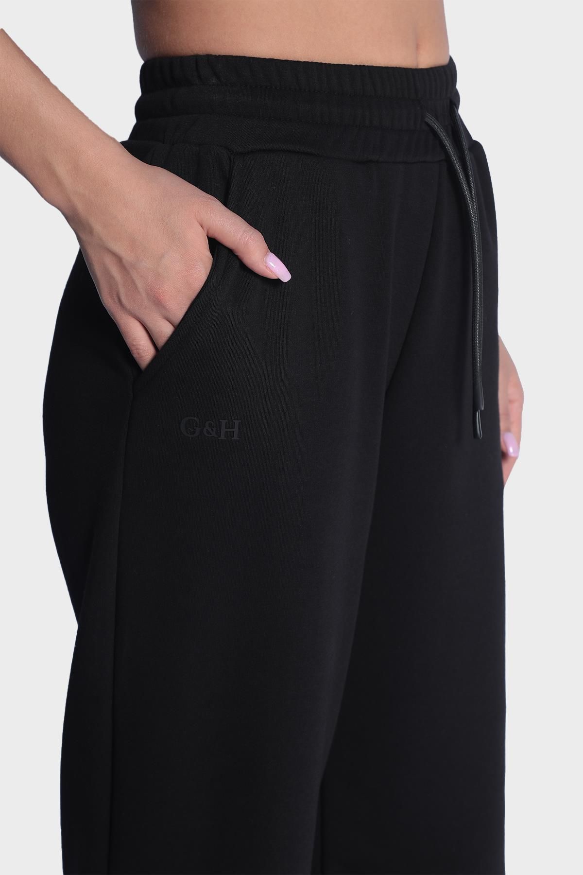 Женские широкие спортивные штаны с эластичной талией - Черный